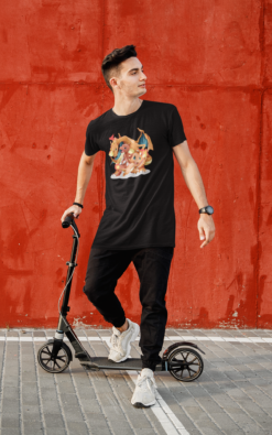 Man riding a scooter while wearing a black T-shirt with a design featuring Charizard, Charmander, and Charmeleon from Pokémon.