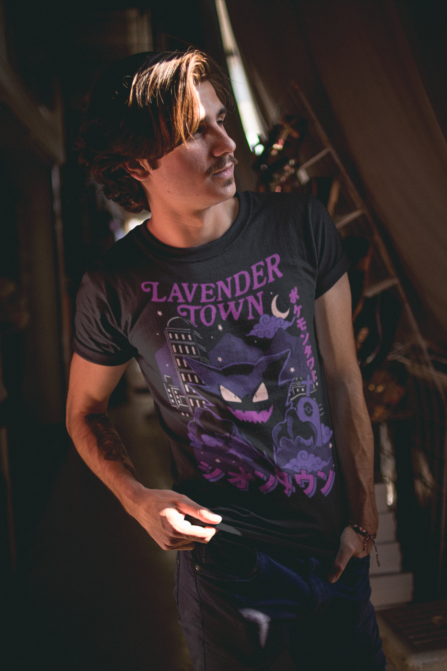 Man wearing black Lavender Town Pokémon tee featuring Haunter and spooky cityscape