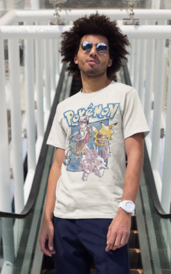 Vintage 1997 Pokémon T-shirt with Red Ketchum, Pikachu, and Nidoran worn by man on escalator