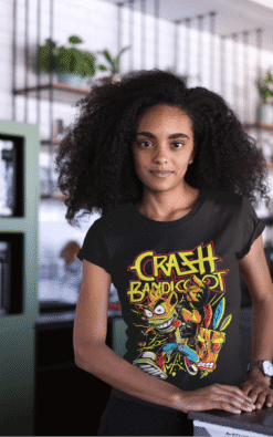 Woman wearing a black Crash Bandicoot vintage band t-shirt indoors at a café.