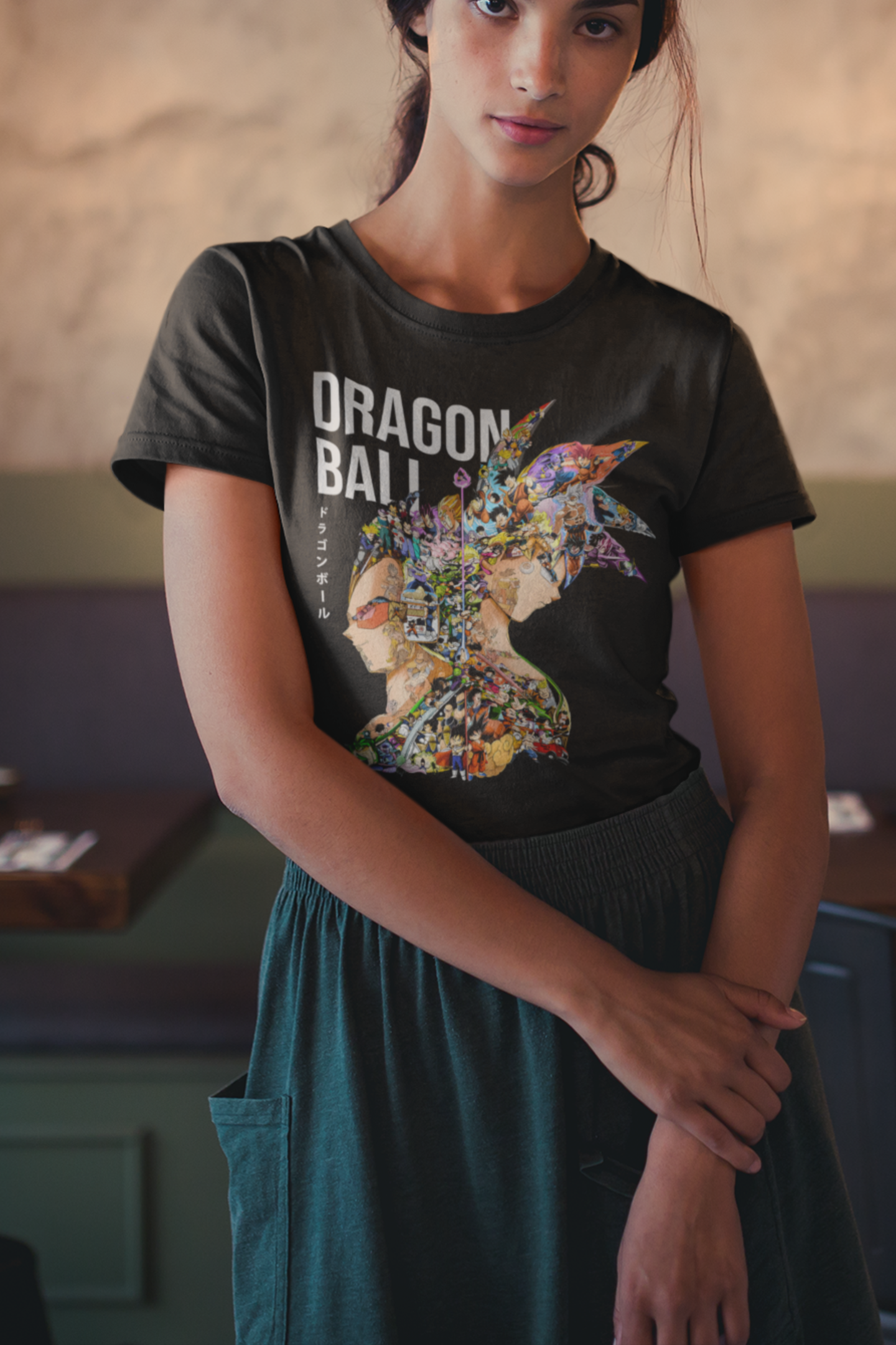 Woman wearing black Dragon Ball tee with detailed anime character collage in Goku and Vegeta silhouette