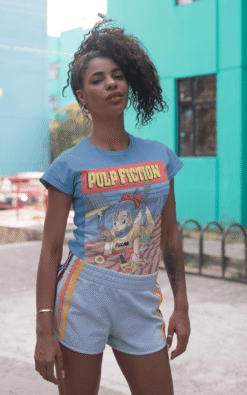 Woman with kinky hair wearing Bulma Pulp Fiction mashup t-shirt and workout shorts