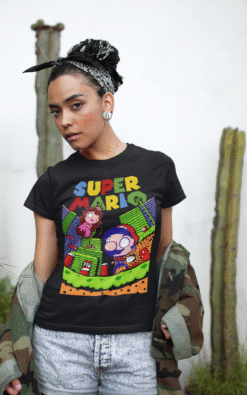 Woman wearing black Super Mario unisex t-shirt with camo jacket and vintage gaming style design