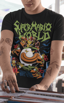 Tattooed man wearing black heavy metal style Super Mario World t-shirt in record store setting.